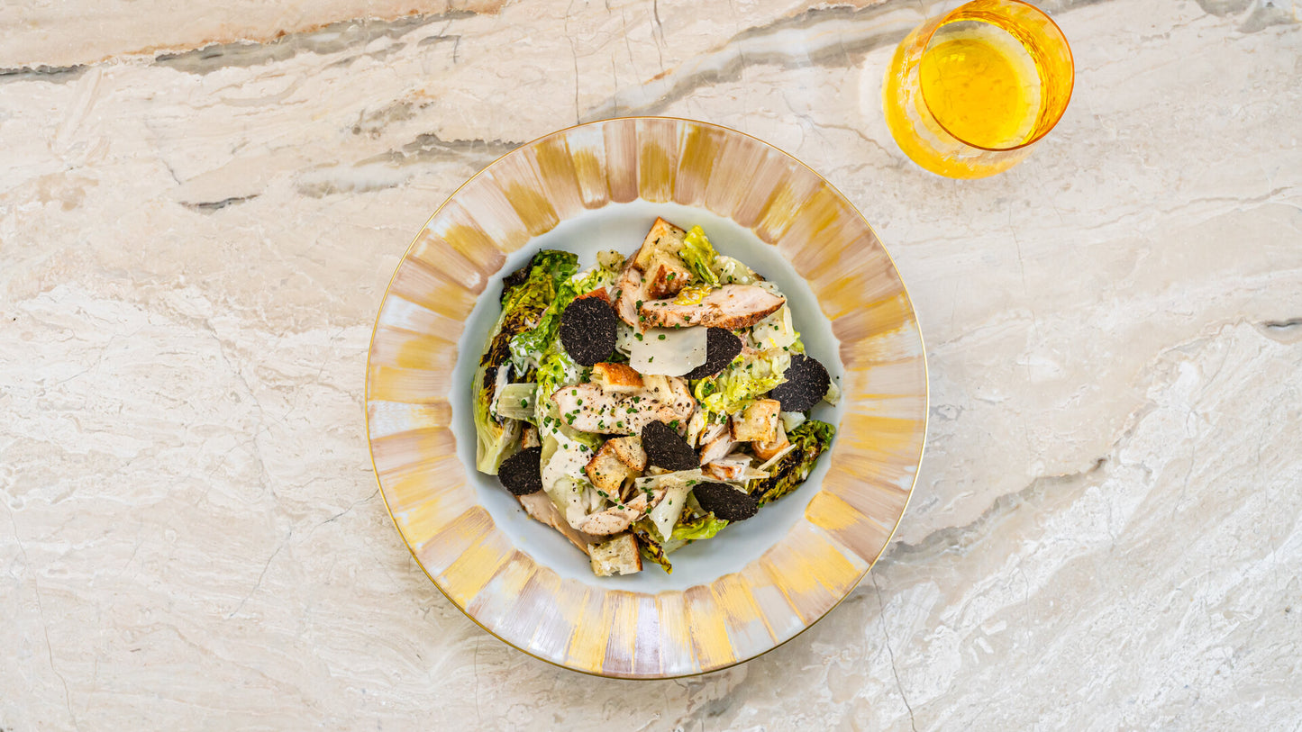 Caesar salad with grilled chicken and shaved truffle